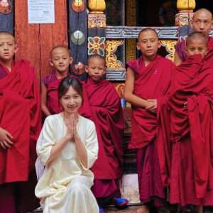 Tongli with monk in Paro Dzong in Bhutan