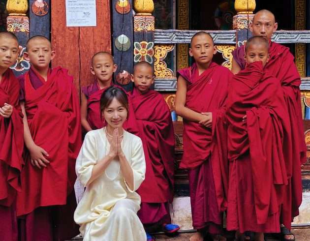 Tongli with monk in Paro Dzong in Bhutan